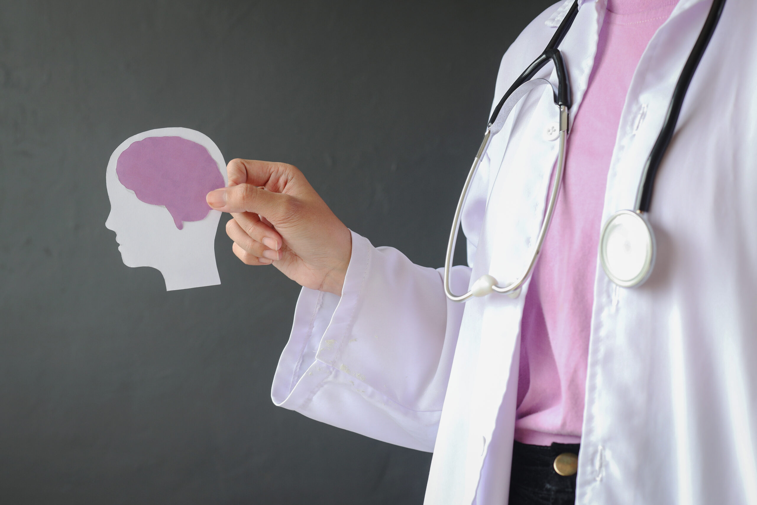 doctor-holding-brain-silhouette-in-medical-setting-2026-03-24-03-36-51-utc